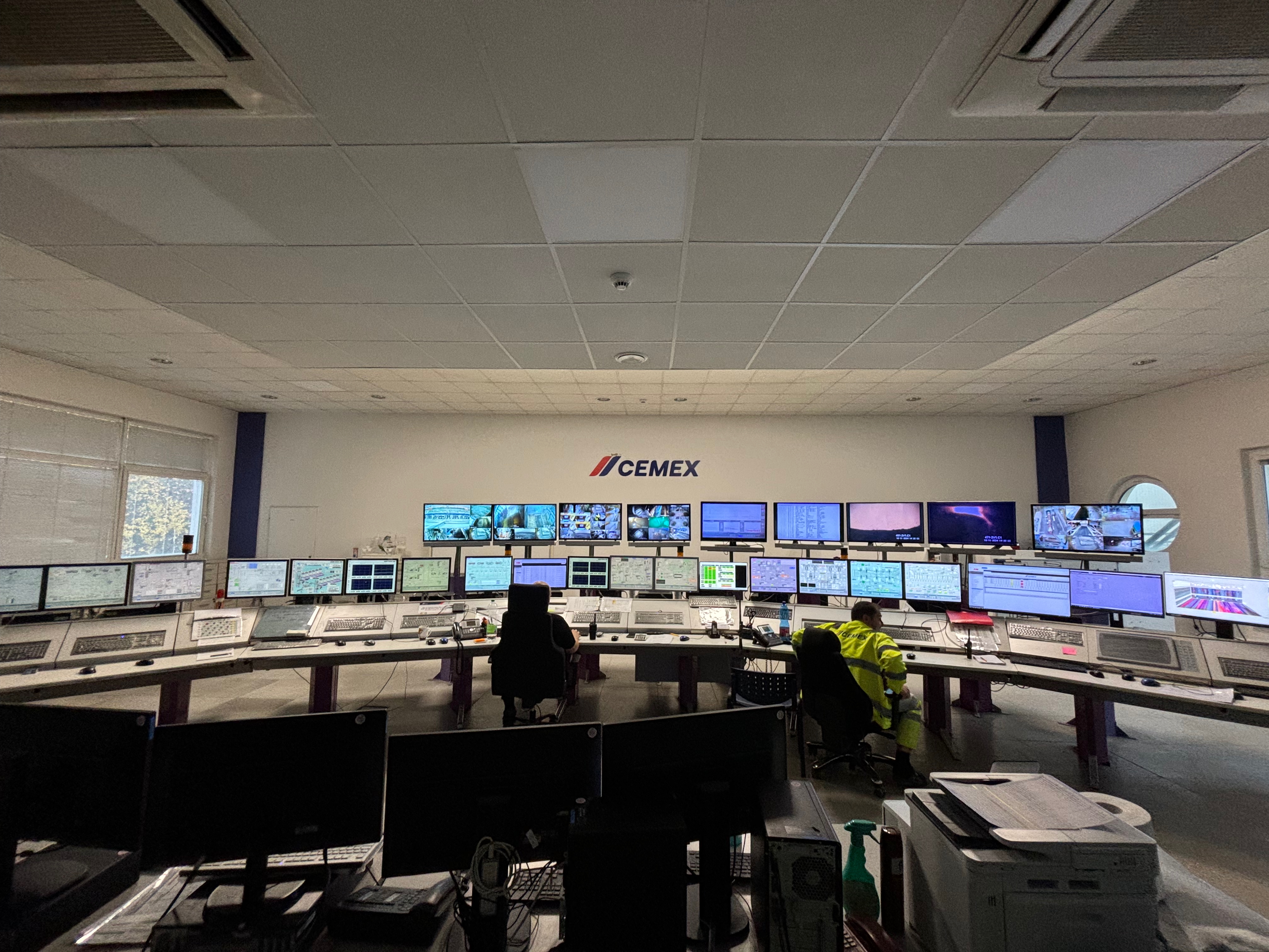 CEMEX cement plant control room with multiple monitoring screens