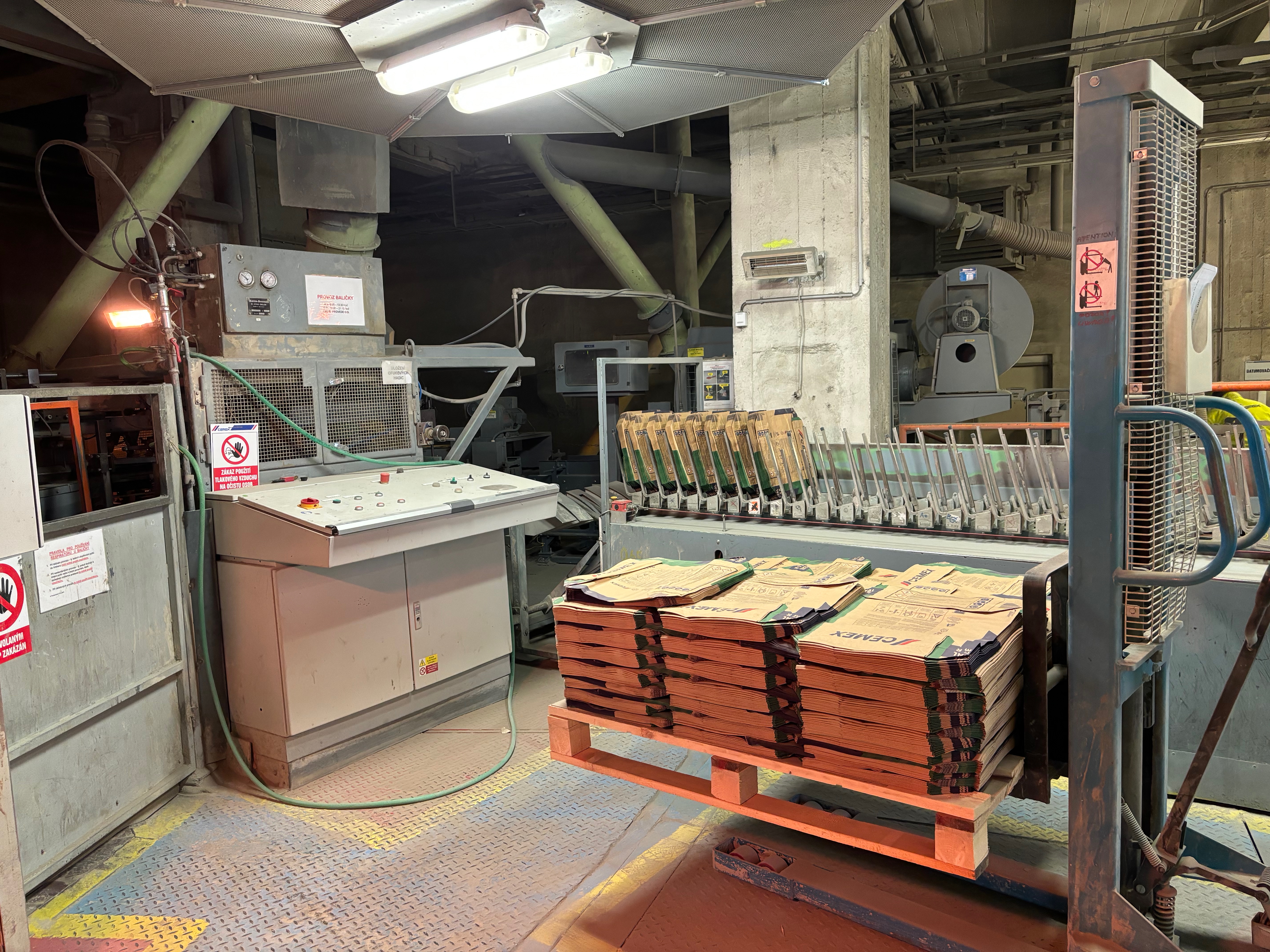 CEMEX industrial plant machinery and cement bags in production environment