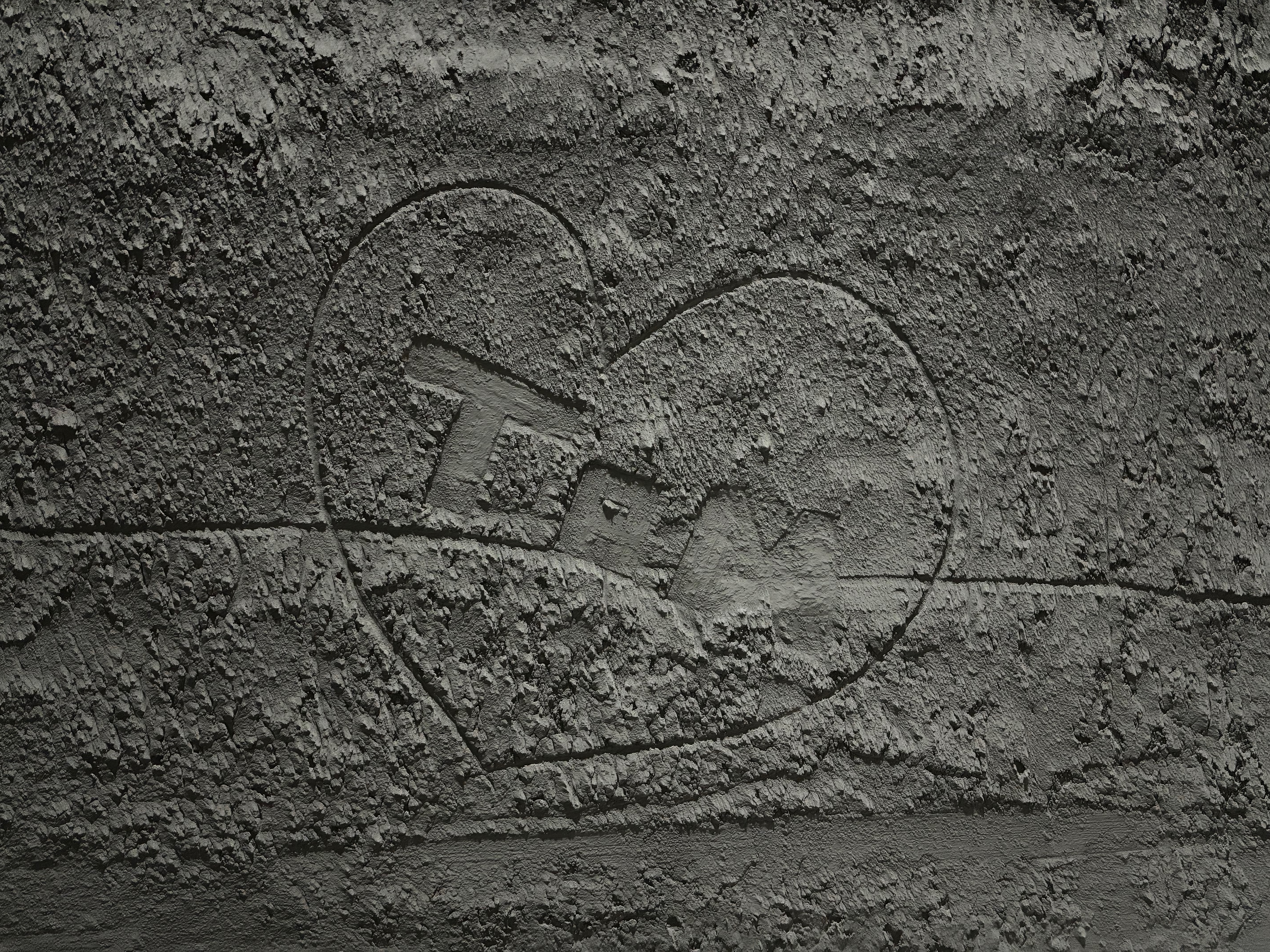 Heart symbol drawn into cement texture